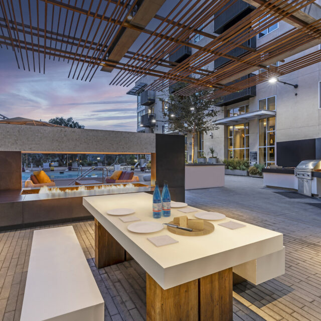 camden-glendale-apartments-glendale-ca-barbecue-grilling-stations-with-outdoor-dining-table-and-fireplace.jpg_1